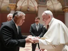 Pope Francis greets Hungarian Prime Minister Viktor Orbán in Budapest, Sept. 12, 2021.